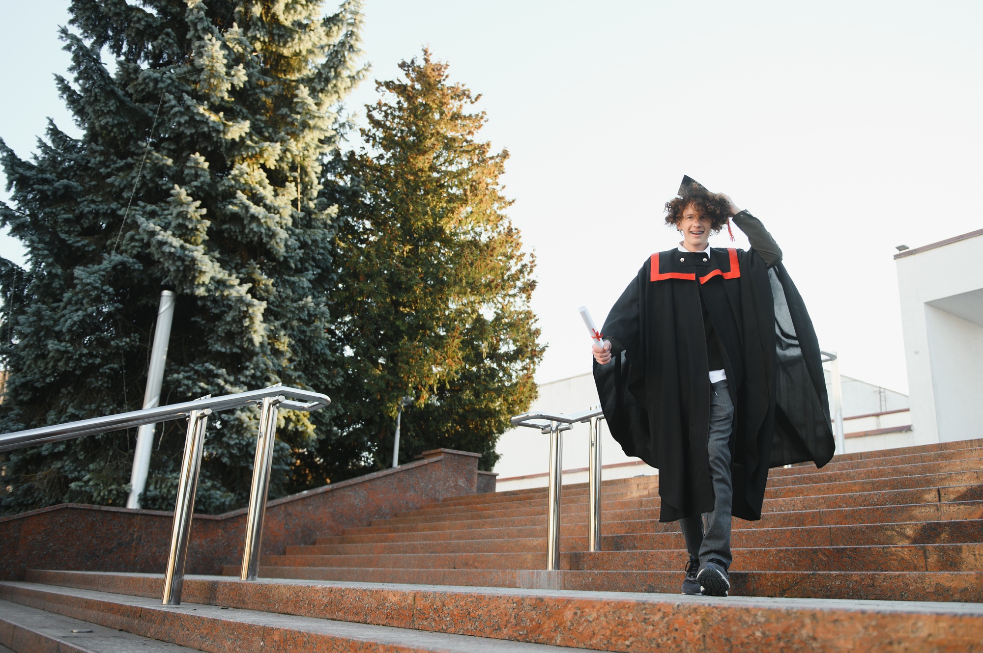 Excited male student in mantle scream graduate from university finish course studying.